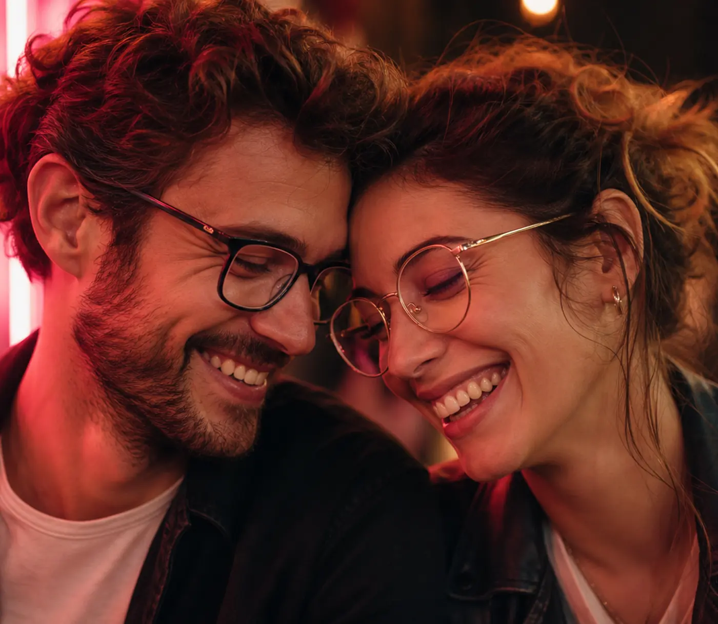 Couple in prescription glasses laughing together